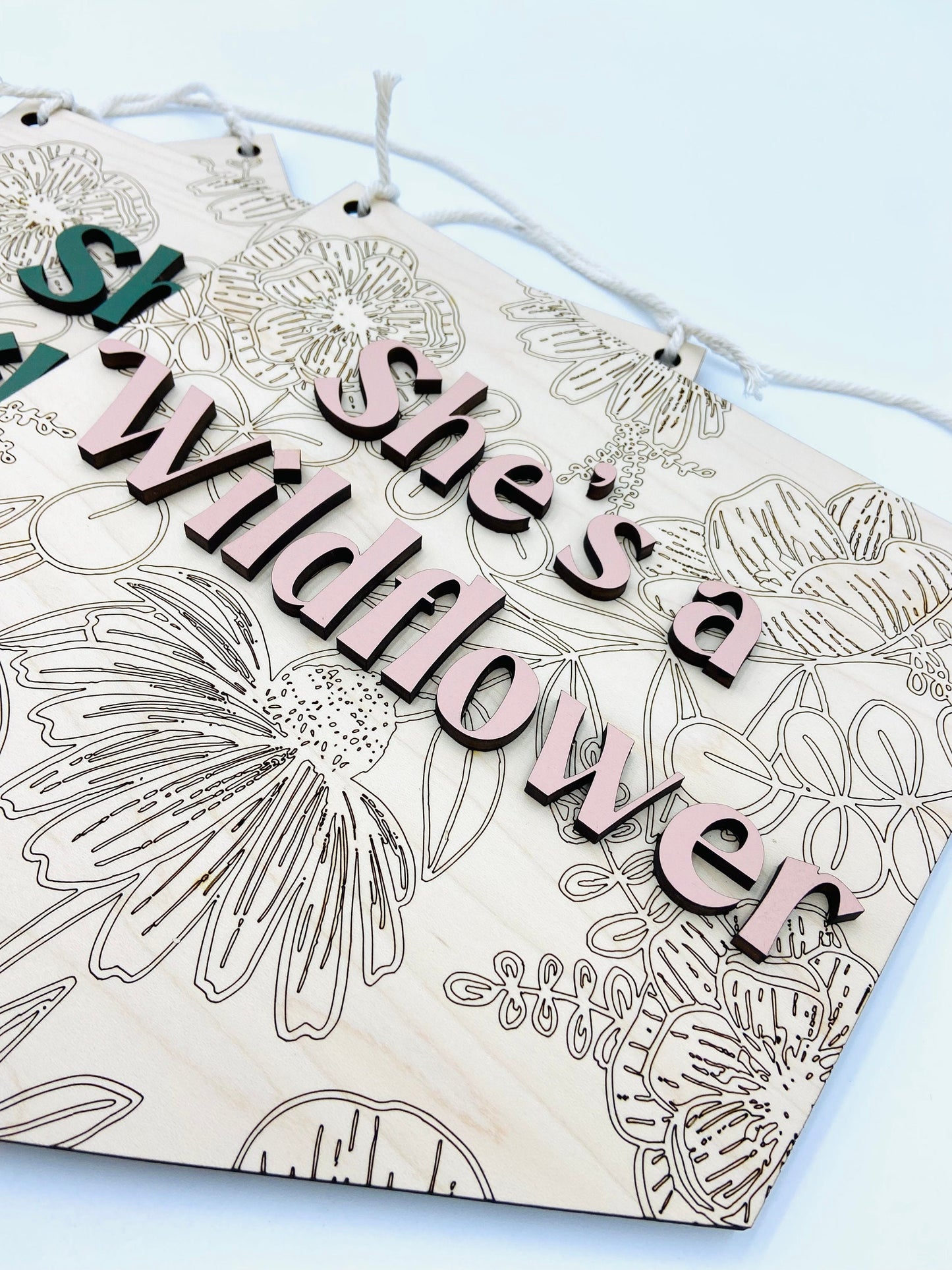 She's a wildflower wooden wall hanging