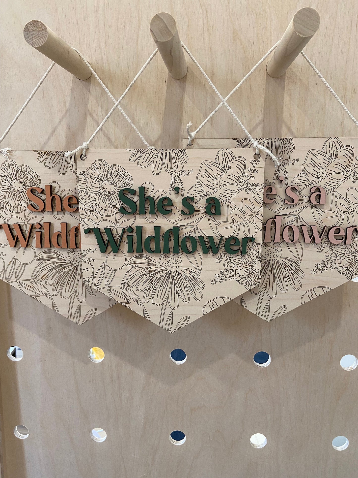 She's a wildflower wooden wall hanging