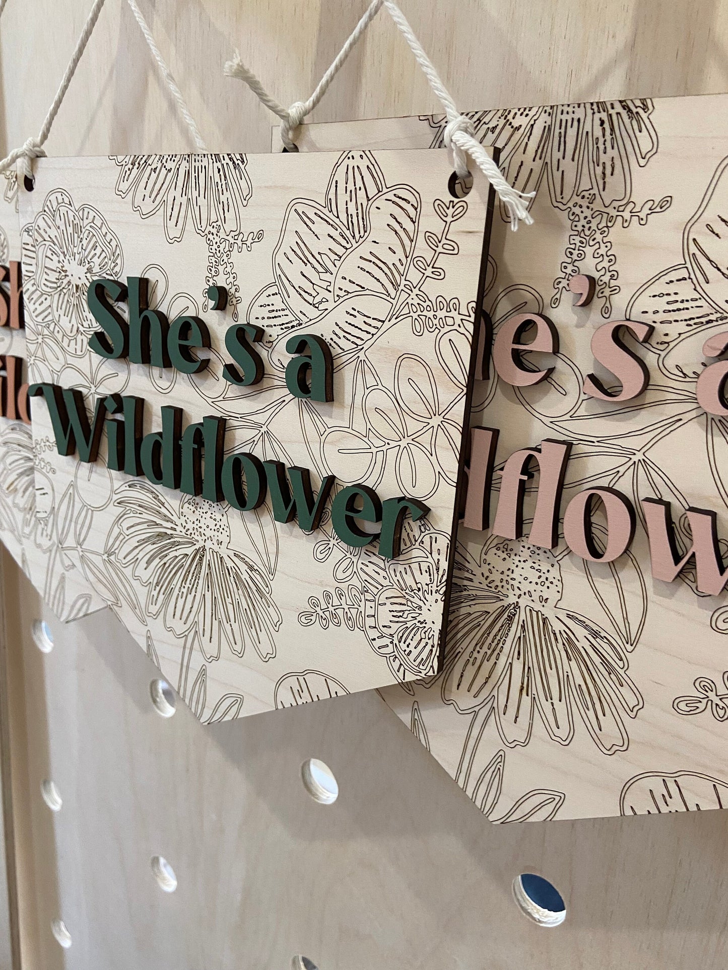 She's a wildflower wooden wall hanging