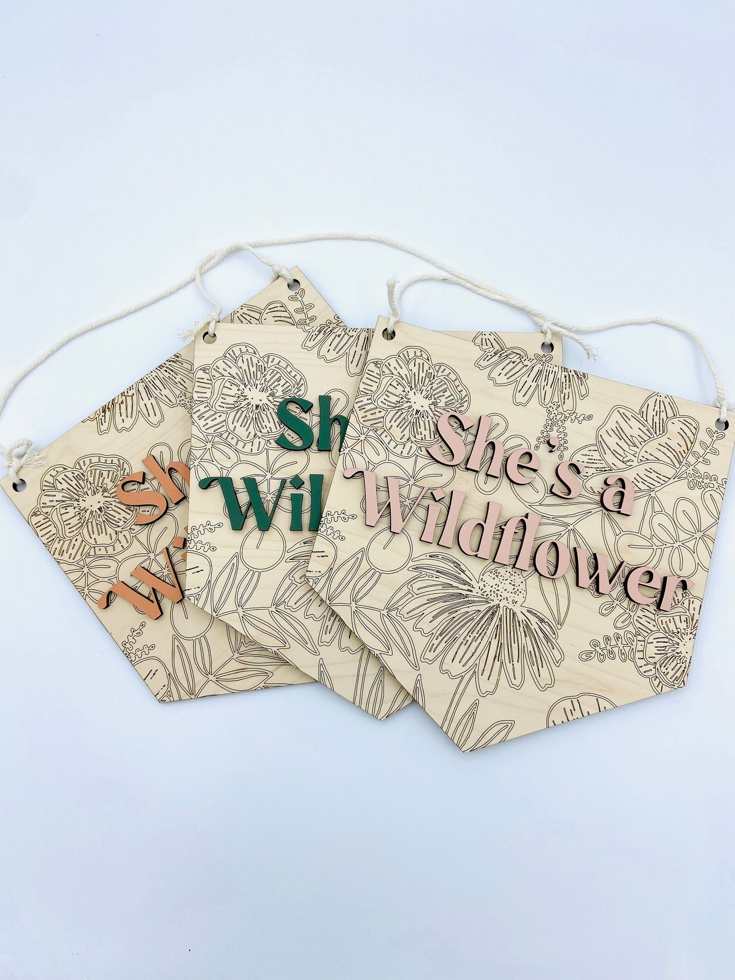 She's a wildflower wooden wall hanging