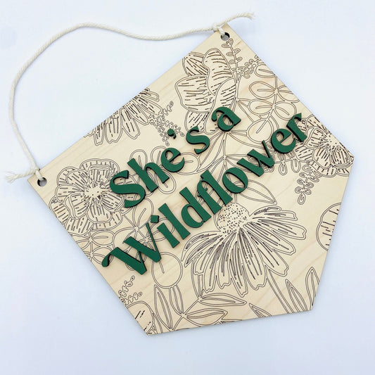 She's a wildflower wooden wall hanging